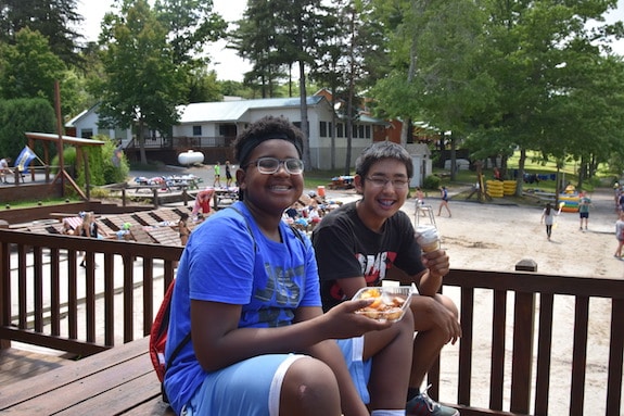 boys eating lunch at summer camp