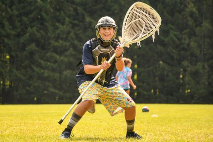 boy playing lacrosse